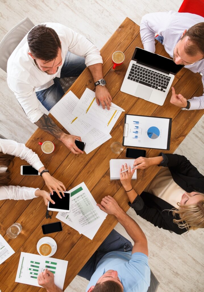 Business team working in an office, seen from above