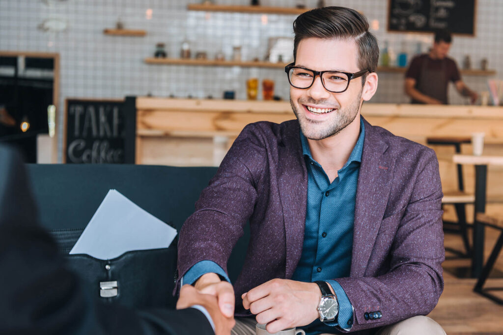 Smiling businessman in a cafe