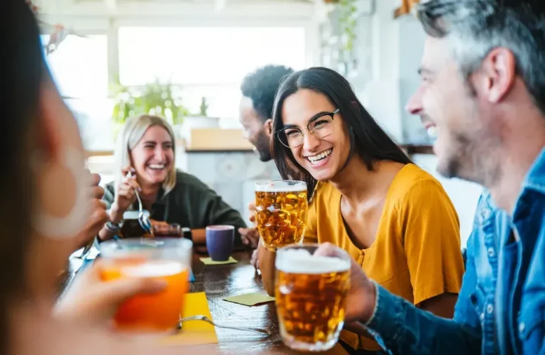 Friends laughing in a pub