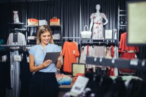 Shop owner with her stock, one of the websites that win local customers