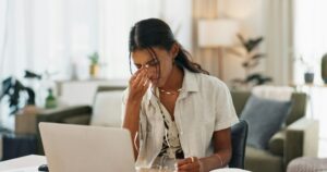 Frustrated owner at a laptop because small business websites are not bringing enquiries