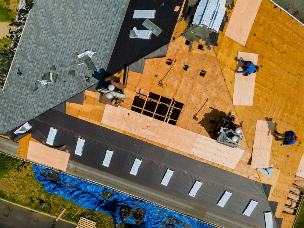 Roofers at work on a house