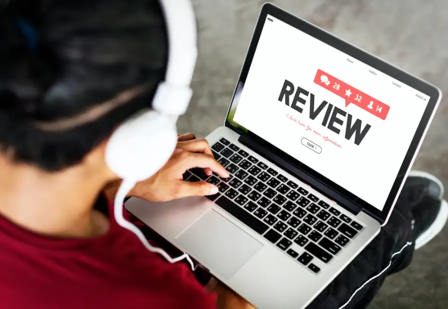 Someone leaving a review on a laptop